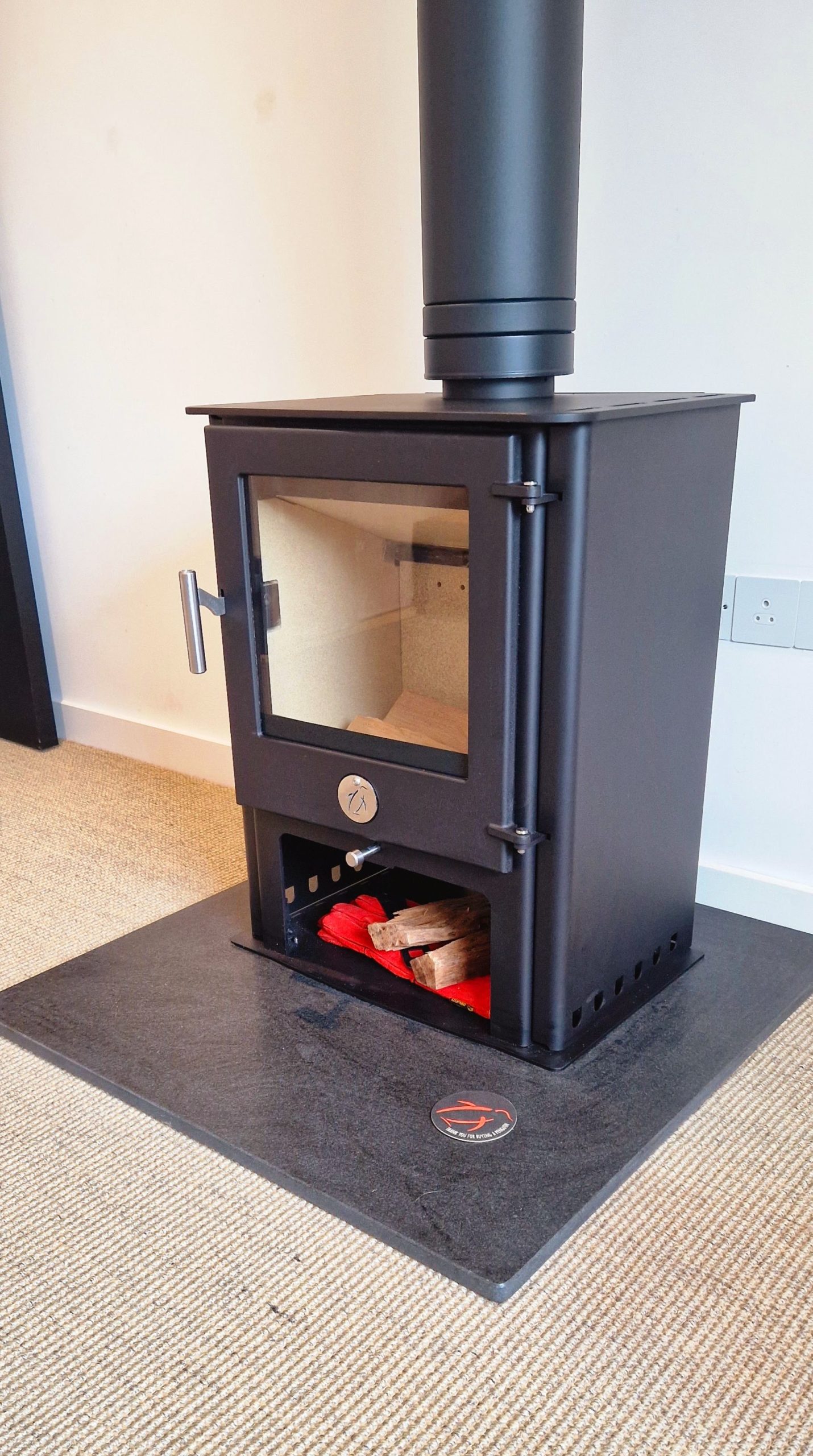 Chilli Penguin Fubsy stove on custom made honed granite hearth